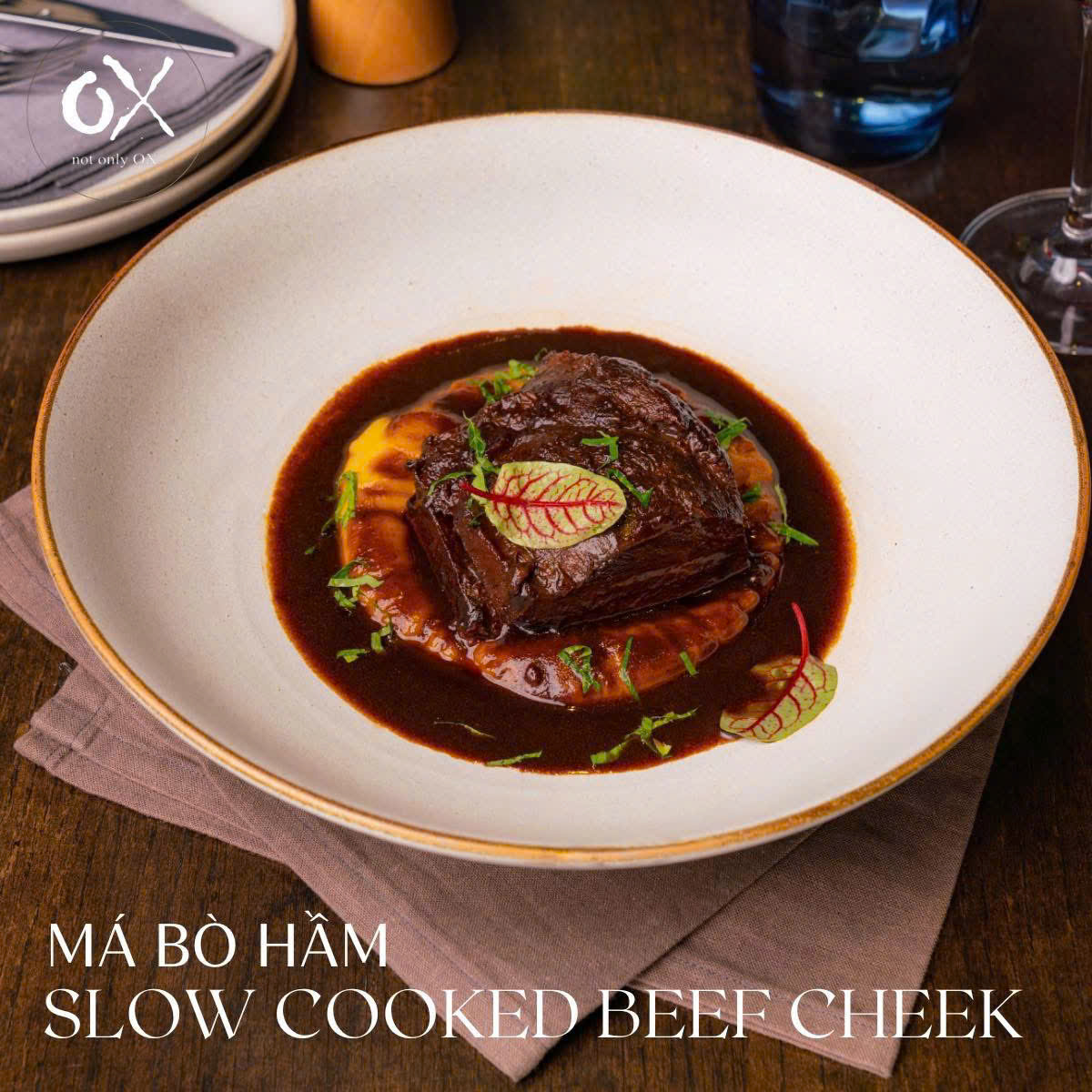 Slow-cooked beef cheek on orange purée with its original printed Vietnamese and English titles